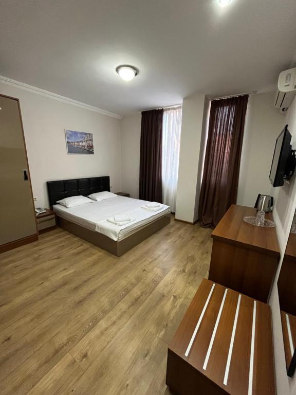 Postel nebo postele na pokoji v ubytování Ventura Hotel