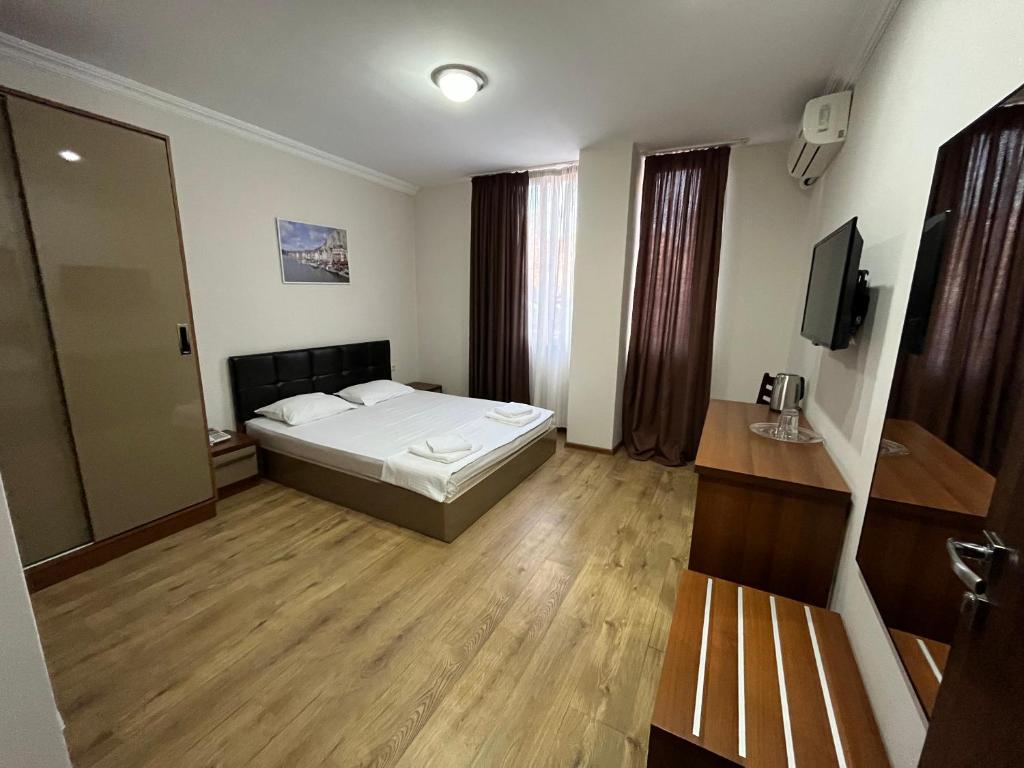 Postel nebo postele na pokoji v ubytování Ventura Hotel