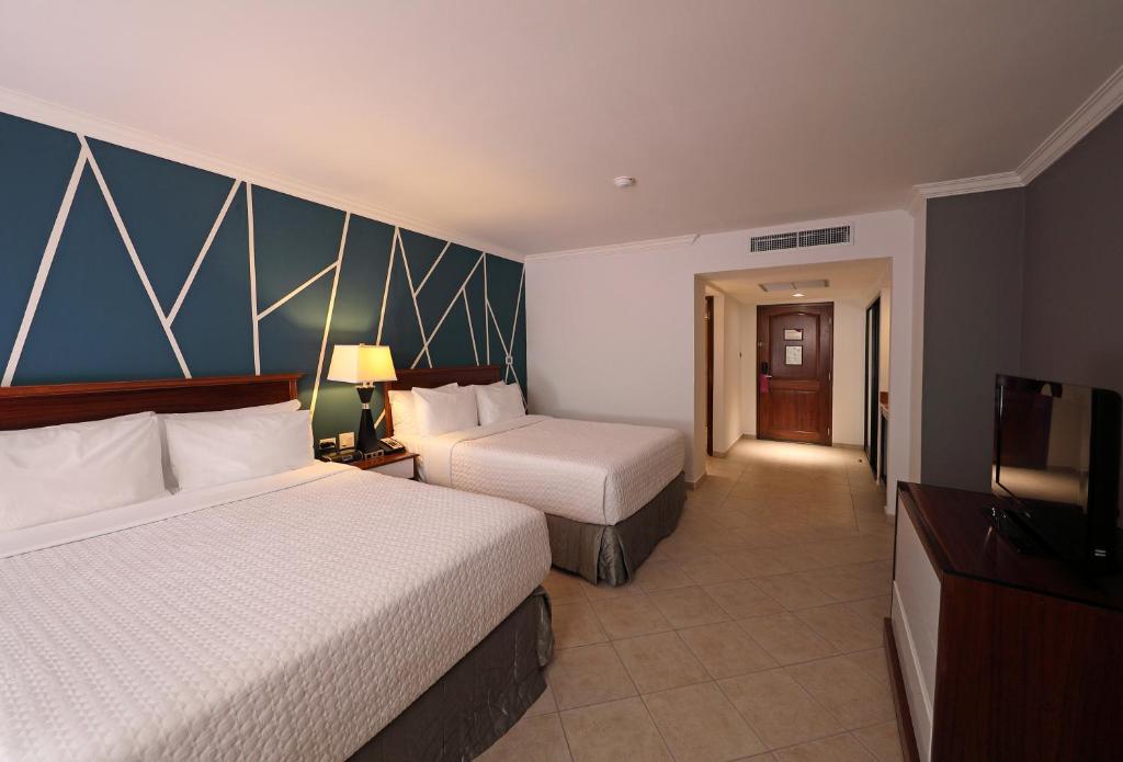Postel nebo postele na pokoji v ubytování Crowne Plaza Panama by IHG