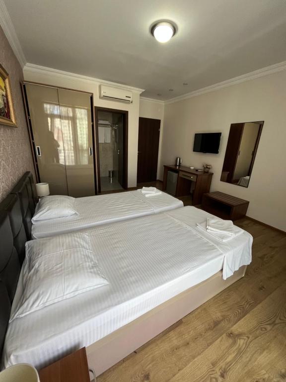 Postel nebo postele na pokoji v ubytování Ventura Hotel
