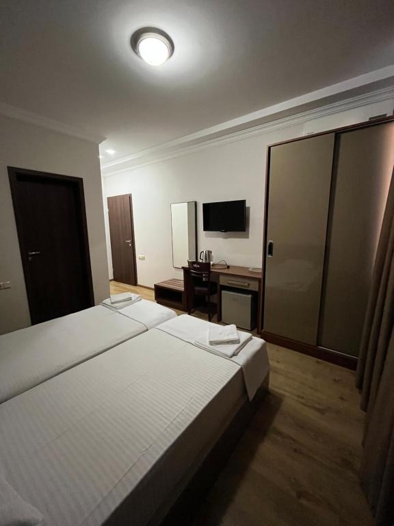 Postel nebo postele na pokoji v ubytování Ventura Hotel