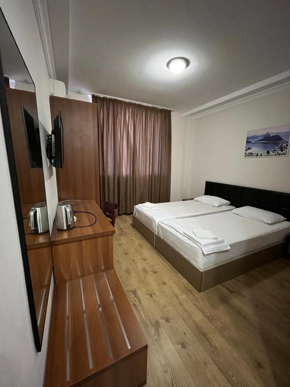 Postel nebo postele na pokoji v ubytování Ventura Hotel