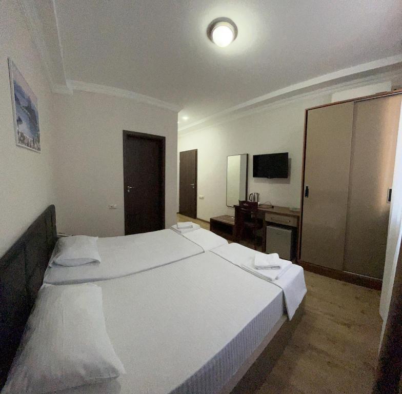 Postel nebo postele na pokoji v ubytování Ventura Hotel