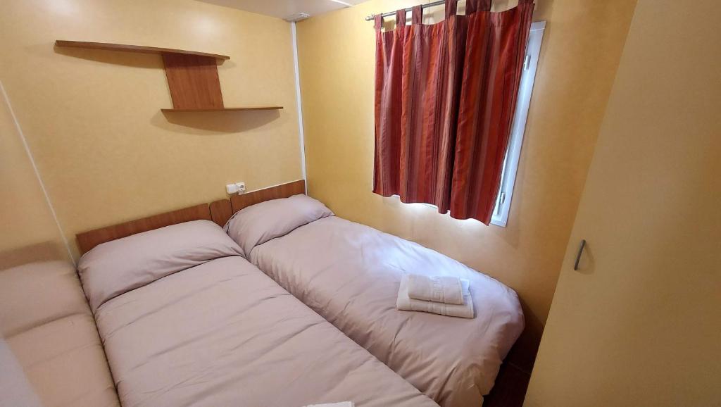 Postel nebo postele na pokoji v ubytování Camping Llavorsi