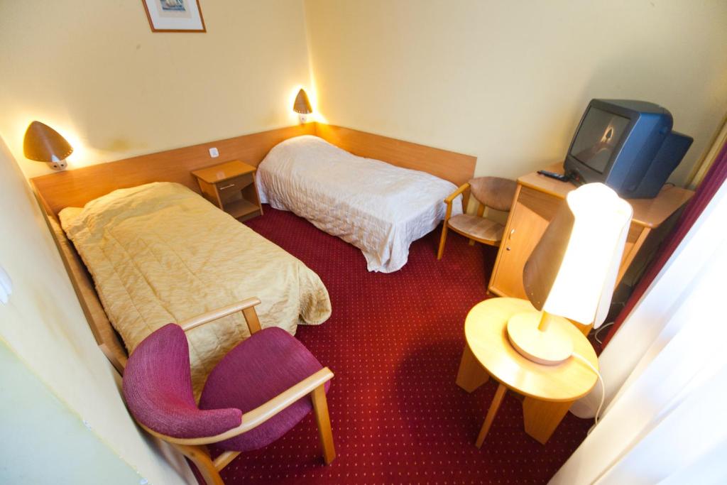Posteľ alebo postele v izbe v ubytovaní Hostel Malinowski City