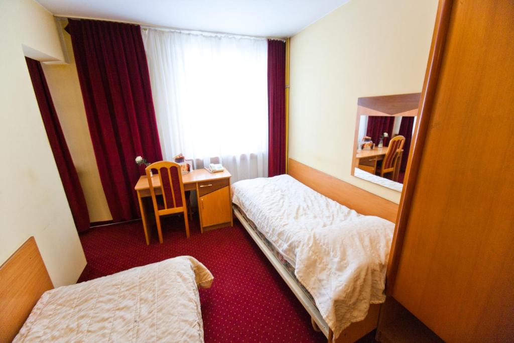 Posteľ alebo postele v izbe v ubytovaní Hostel Malinowski City