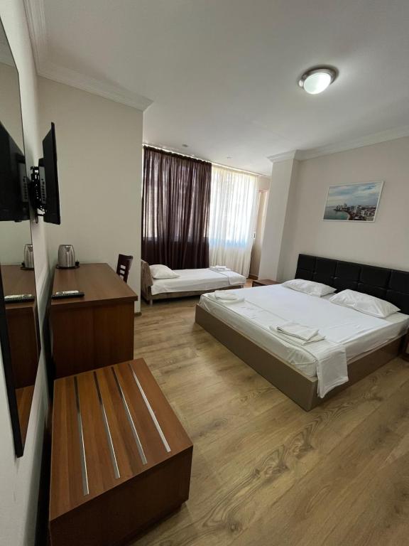 Postel nebo postele na pokoji v ubytování Ventura Hotel