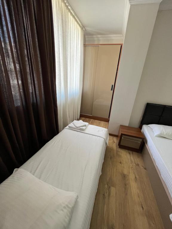 Postel nebo postele na pokoji v ubytování Ventura Hotel