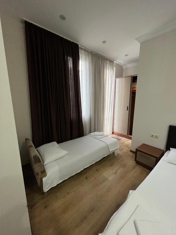Postel nebo postele na pokoji v ubytování Ventura Hotel