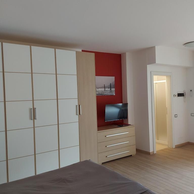TV a/nebo společenská místnost v ubytování Villa Treccani Apartments
