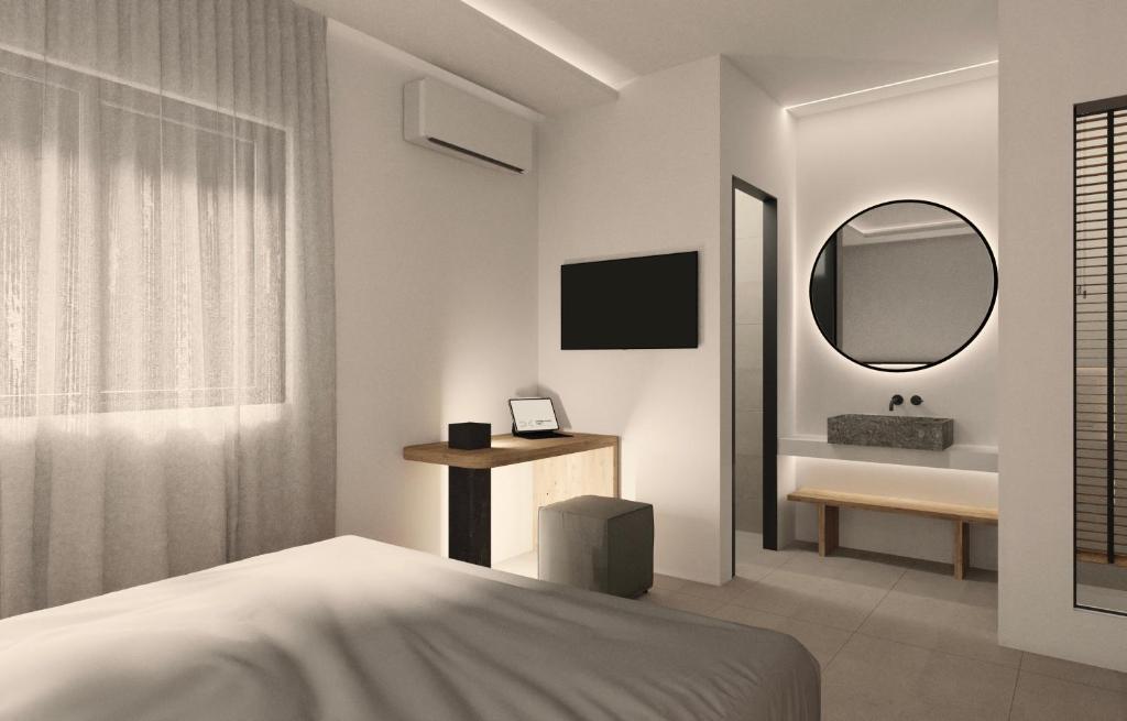 Postel nebo postele na pokoji v ubytování Neapolis 21 Suites, Premium Key Collection
