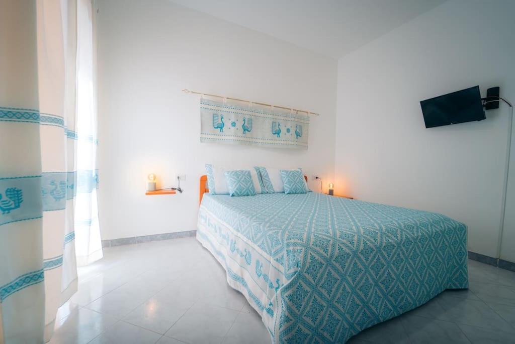 A bed or beds in a room at Dimora Pintau in residence con piscina privata