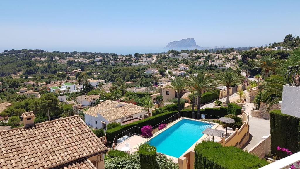 an aerial view of a villa with a swimming pool at La Trufa - modern, spacious home in Moraira with panoramic sea views in Moraira