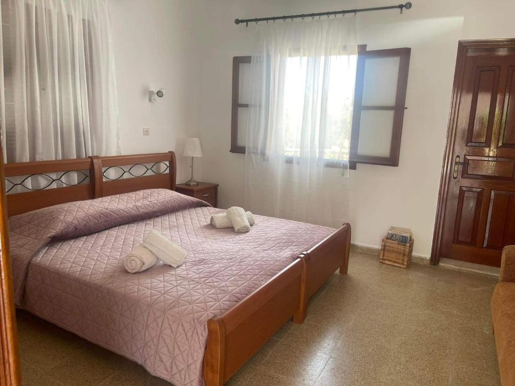 Posteľ alebo postele v izbe v ubytovaní Aegean Endless Summer Villa Pefkos