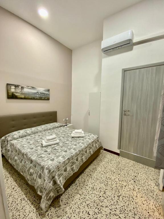 Posteľ alebo postele v izbe v ubytovaní Nel cuore Di Napoli