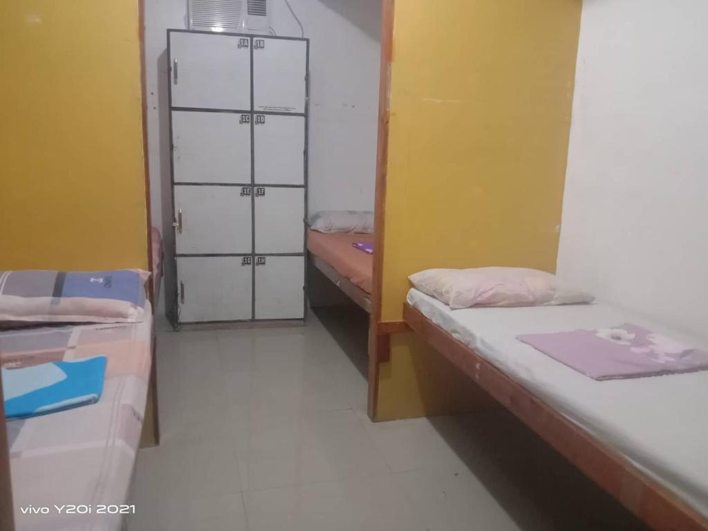 Postel nebo postele na pokoji v ubytování One Hostel - El Nido