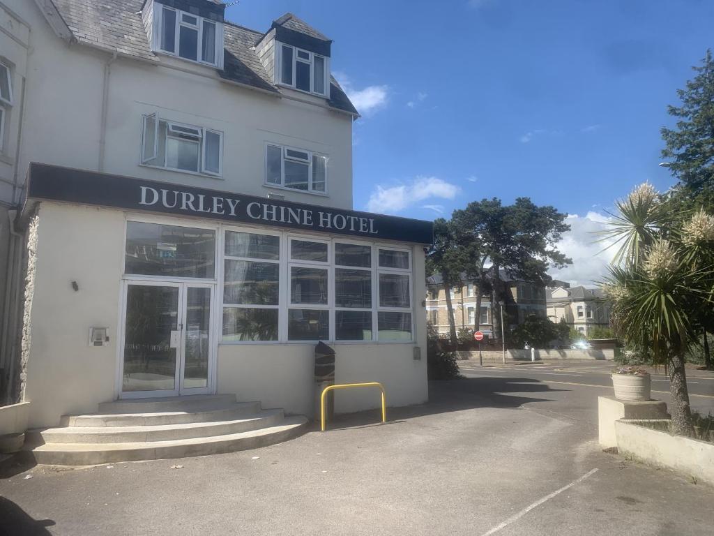 a dumley clinic hotel in front of a building at Durley Chine Hotel in Bournemouth