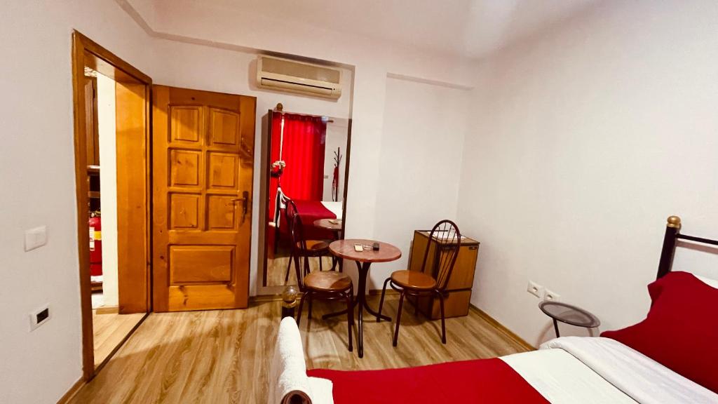 Postel nebo postele na pokoji v ubytování Hotel Drinos