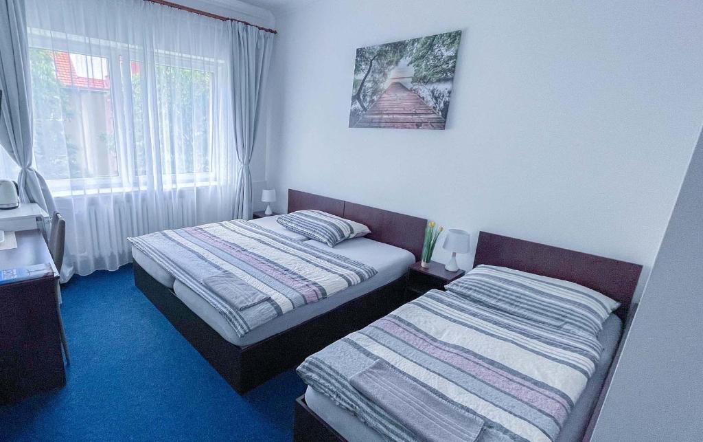 Postel nebo postele na pokoji v ubytování Minihotel Vitex