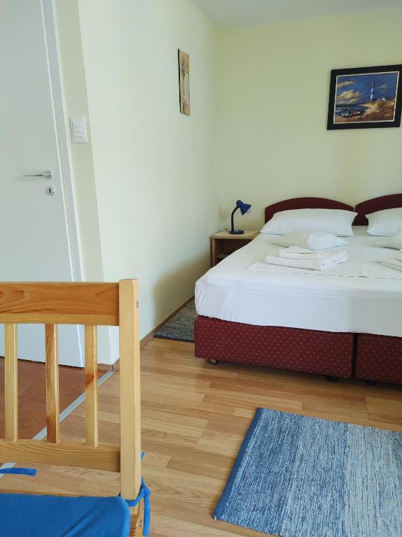 Posteľ alebo postele v izbe v ubytovaní Guesthouse Anna