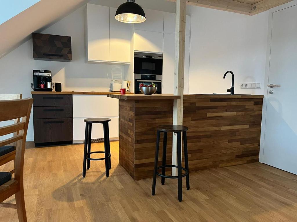 Kuchyň nebo kuchyňský kout v ubytování Traumhafte neue Dachterrassenwohnung am Soyener See