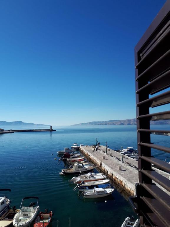 a group of boats docked at a dock in the water at Senia Retro in Senj