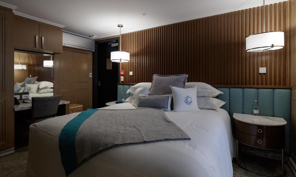 Postel nebo postele na pokoji v ubytování The Carlin Boutique Hotel