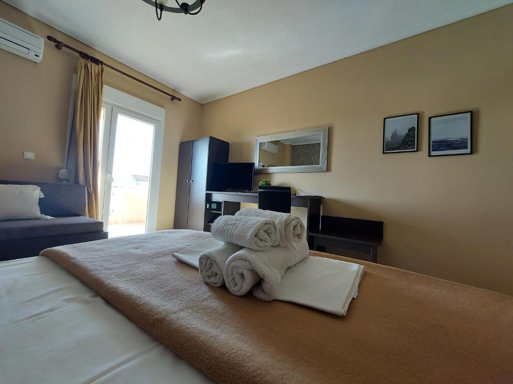 Postel nebo postele na pokoji v ubytování Hotel Epavli