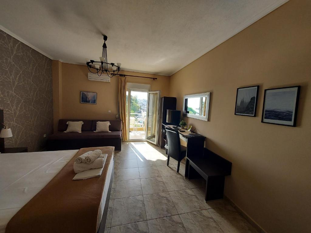 Postel nebo postele na pokoji v ubytování Hotel Epavli