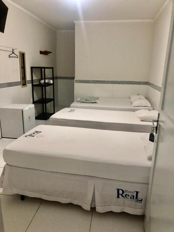 Postel nebo postele na pokoji v ubytování Hotel Real Jequie
