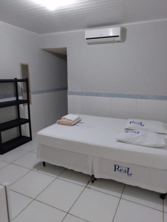Postel nebo postele na pokoji v ubytování Hotel Real Jequie