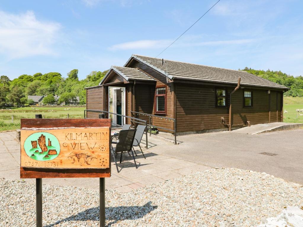 a sign in front of a tiny house at Kilmartin View in Lochgilphead