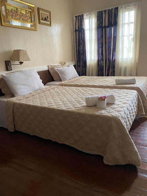 Postel nebo postele na pokoji v ubytování Stefanie Grace Paradise Inn