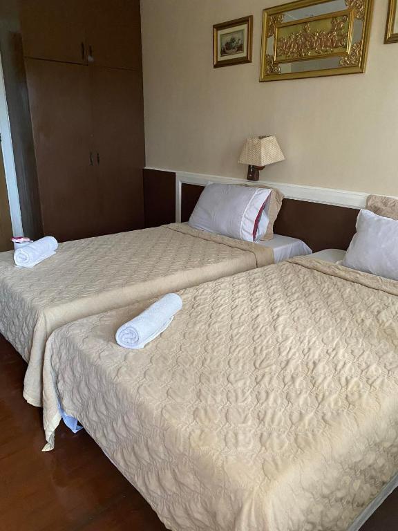 Postel nebo postele na pokoji v ubytování Stefanie Grace Paradise Inn