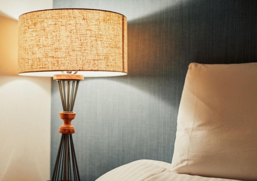 Postel nebo postele na pokoji v ubytování Hotel Graphy Nezu