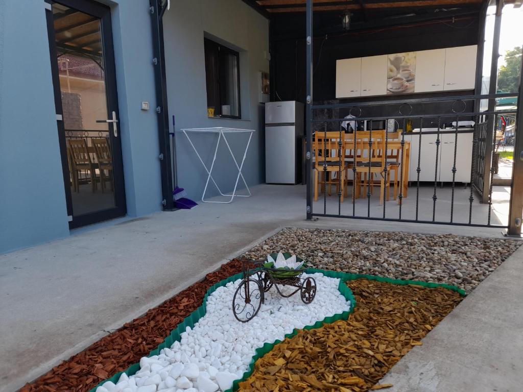 a bike on the ground in front of a building at CasaRiana 3 in Eforie Sud