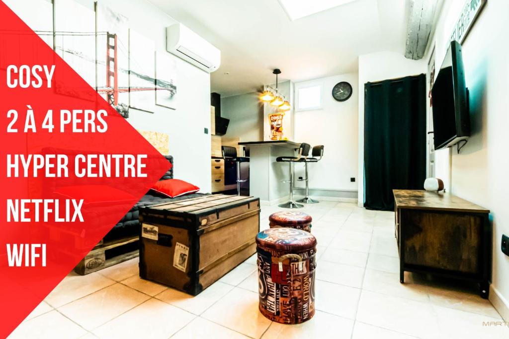 a kitchen with a red sign that reads cvs a pegs at Centre Historique - FREE Parking - Self Checkin - WIFI - INDUSTRIEL - SLEEPNTRIPBEZIERS in Béziers