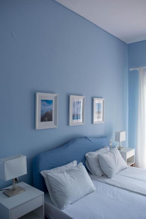 Postel nebo postele na pokoji v ubytování Mirtia Hotel
