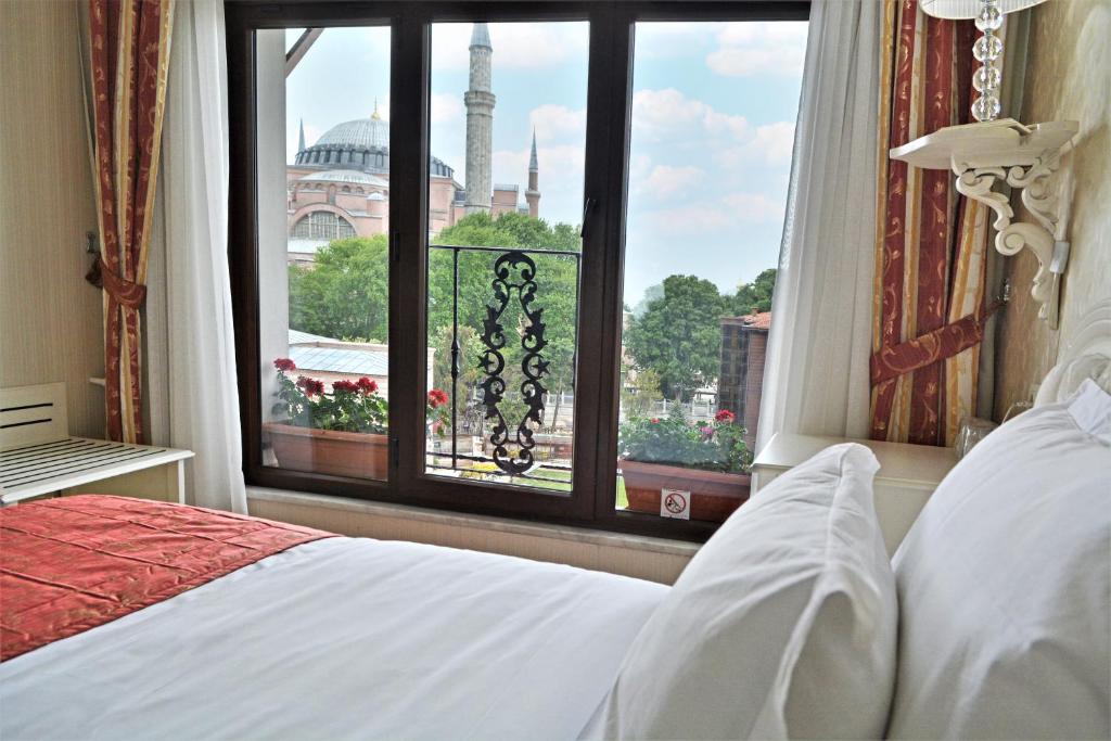 a hotel room with a bed and a window at The And Hotel Sultanahmet- Special Category in Istanbul