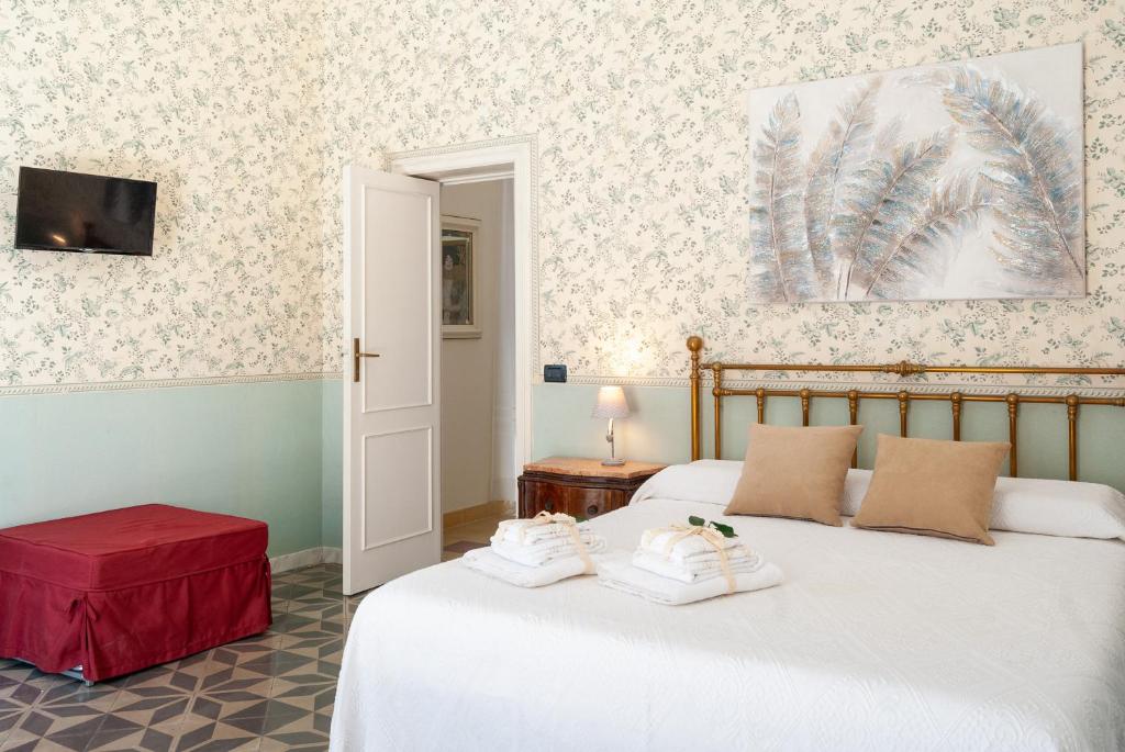 Posteľ alebo postele v izbe v ubytovaní B&B Risveglio col Rosone