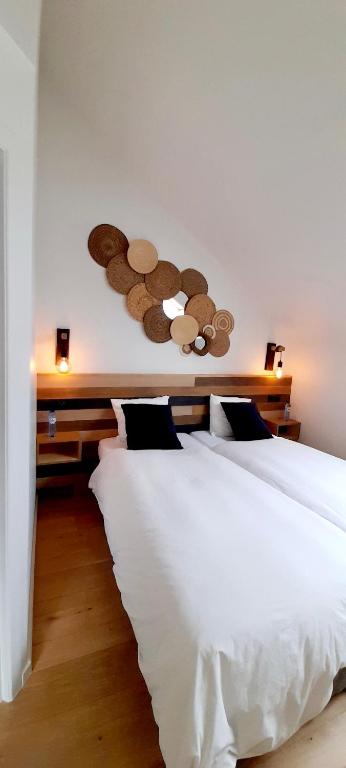 Postel nebo postele na pokoji v ubytování La Ferme du Soyeuru