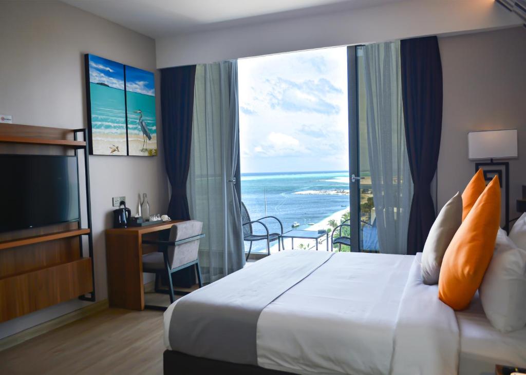 Postel nebo postele na pokoji v ubytování Triton Prestige Seaview and Spa