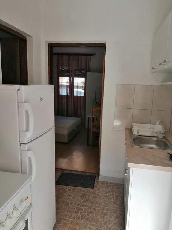 a kitchen with a sink and a refrigerator at Apartment’s Maric - Zelenika,Herceg Novi in Zelenika