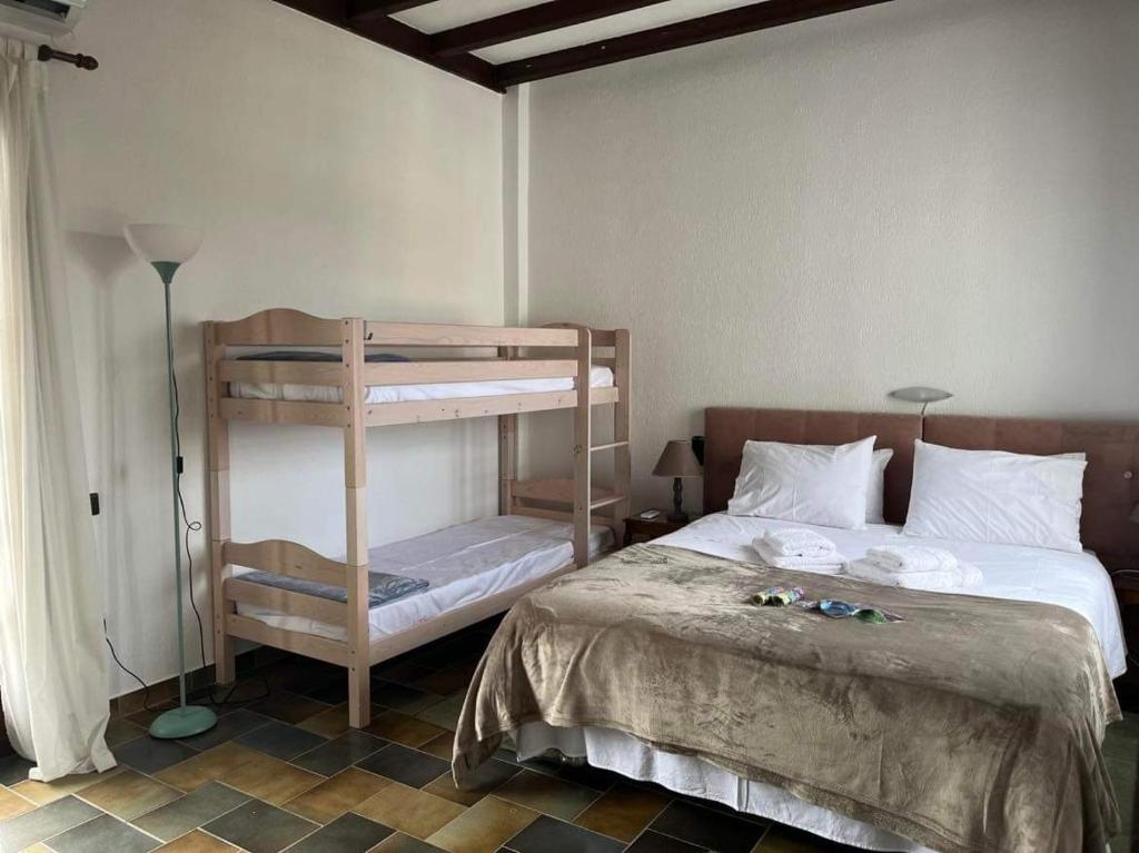 A bed or beds in a room at Villa Velissarios: wonderful villa next to beach