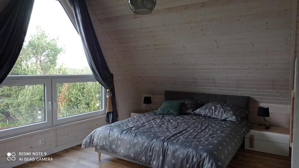 Postel nebo postele na pokoji v ubytování Chatka Leo