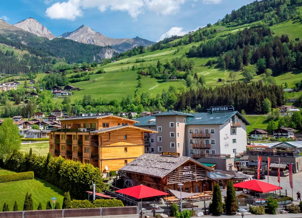 a town in a valley with mountains in the background at AlpenParks Montana Apartments in Matrei in Osttirol