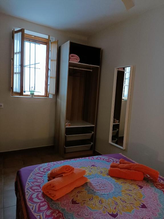 A bed or beds in a room at Casa AMALFi, Coqueta casa Centro histórico de Vejer