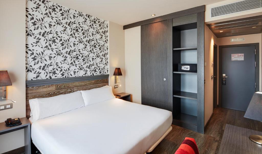 Postel nebo postele na pokoji v ubytování Sercotel Plaza Feria