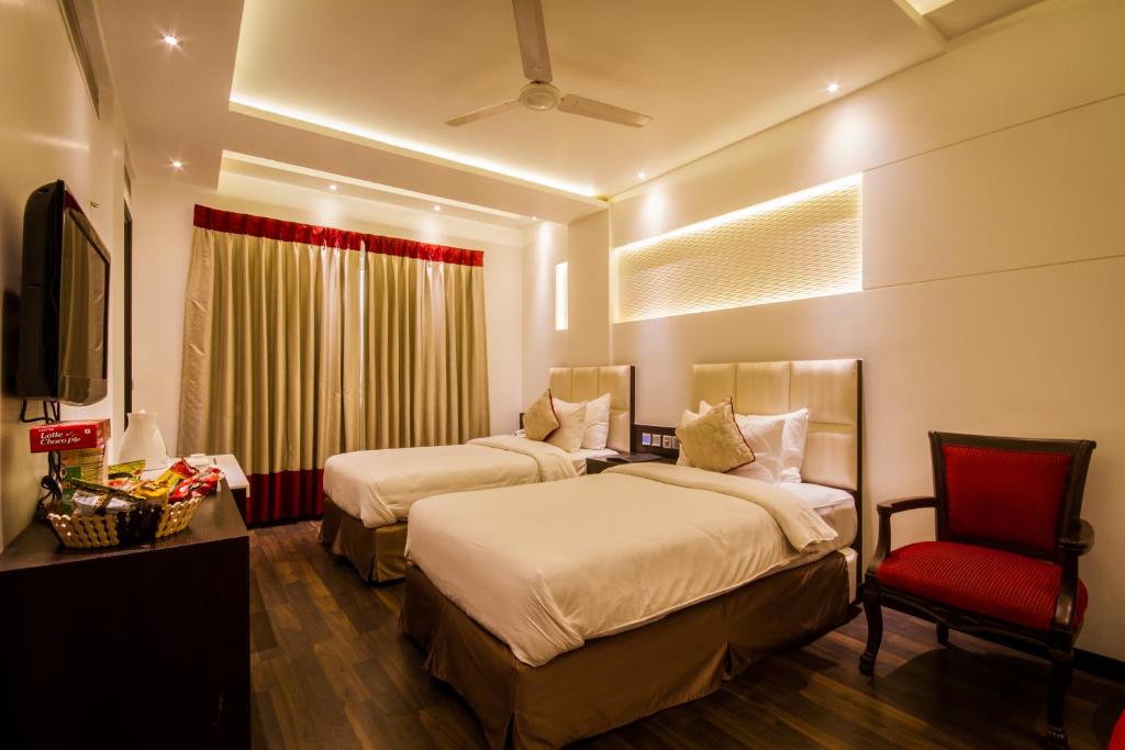 Postel nebo postele na pokoji v ubytování Hotel Grand Godwin Near New Delhi Railway Station