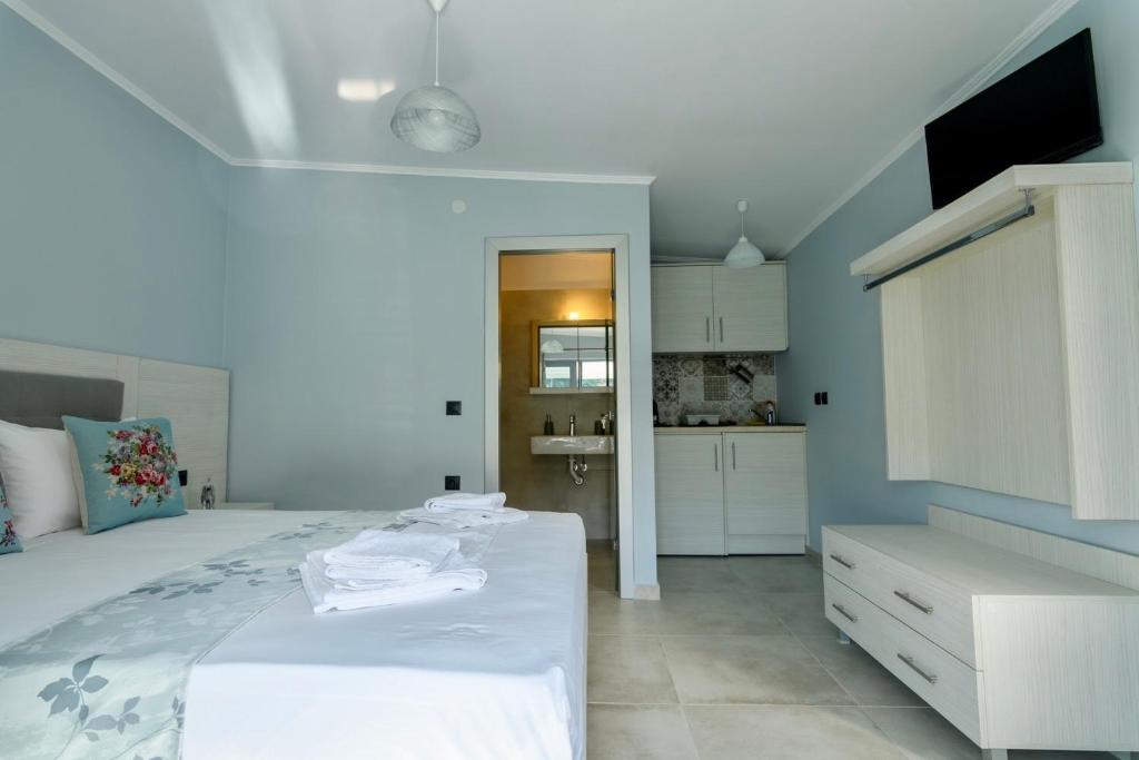 Posteľ alebo postele v izbe v ubytovaní Michaelangelo Apartments